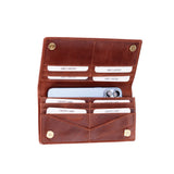 A brown leather card holder wallet shown open, displaying multiple card slots, a phone slot with a light blue smartphone inserted, and brass snap buttons on the corners, set against a plain white background.