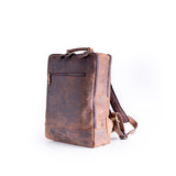The Leather Travel Backpack Ryde by Vintage Leather Sydney features a vintage-style brown leather design with a front zip pocket, top handle, and adjustable straps—combining style and functionality against a white background.