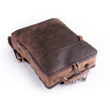 The Leather Travel Backpack Ryde by Vintage Leather Sydney, featuring visible zippers, sturdy stitching, and metal hardware, is shown lying flat on a white background—ideal for carrying your essentials in style.