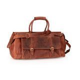 A brown distressed leather duffel bag with double top handles, a detachable shoulder strap, and brass buckle details, shown on a plain white background.