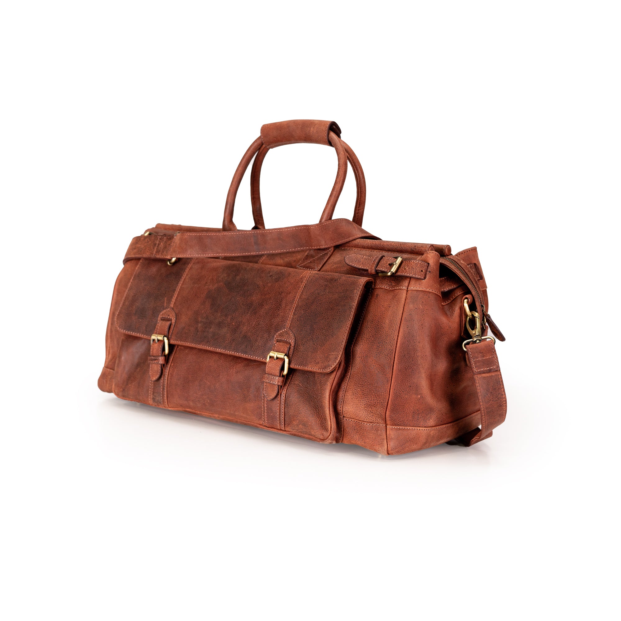 A brown distressed leather duffel bag with gold-tone hardware, featuring dual top handles, front flap pockets with buckle details, and a detachable shoulder strap, photographed on a clean white background.