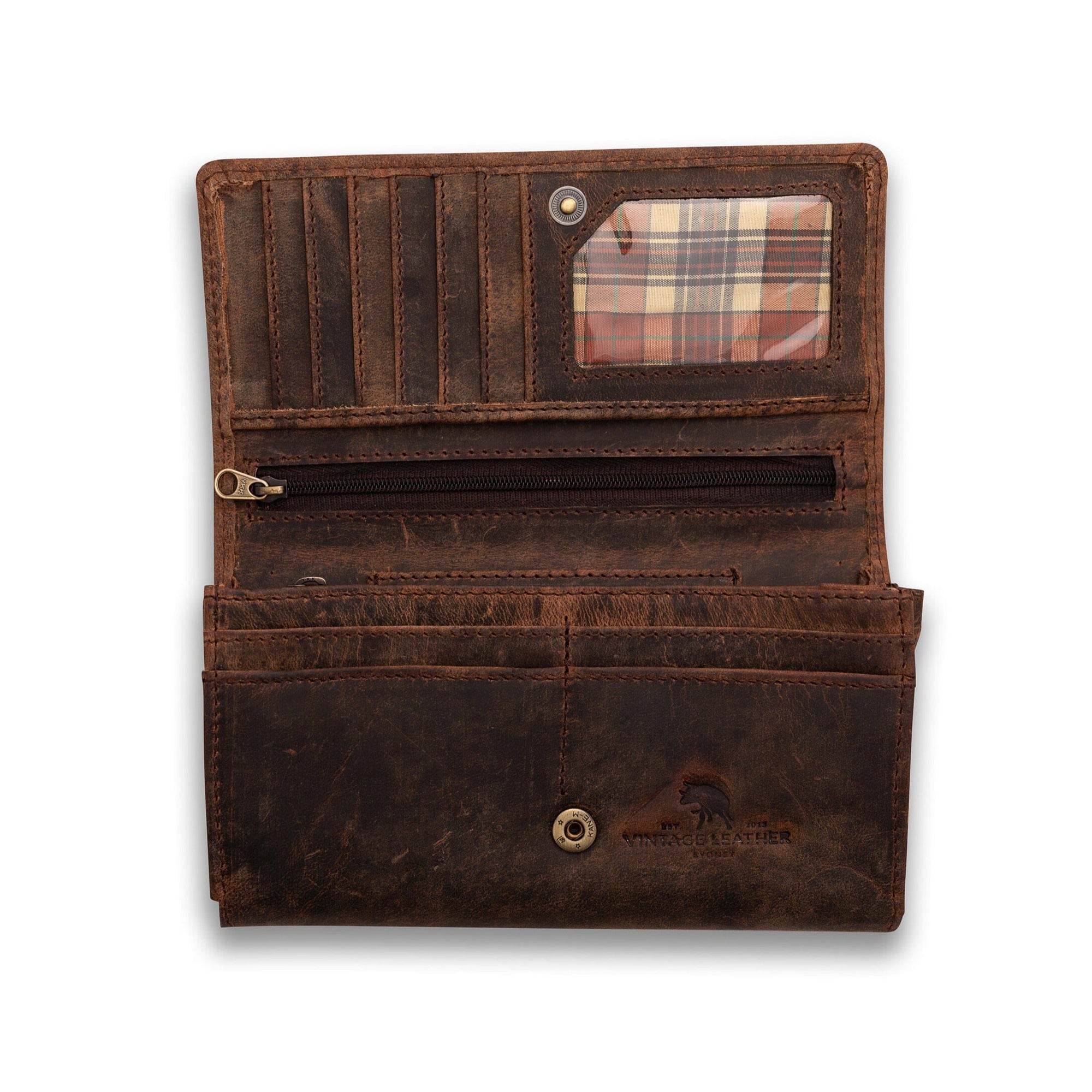 The Vintage Leather Sydney Women's Leather Wallet Adel in brown features card slots, a zippered pocket, an ID window with a plaid pattern, roomy compartments, snap button closure, and a stylish worn vintage look.