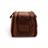 A brown Leather Travel Toiletry Bag Porter by Vintage Leather Sydney stands upright on a white background, featuring two zippered side compartments, a front pocket with an embossed logo, and is perfect for organizing toiletries when traveling.