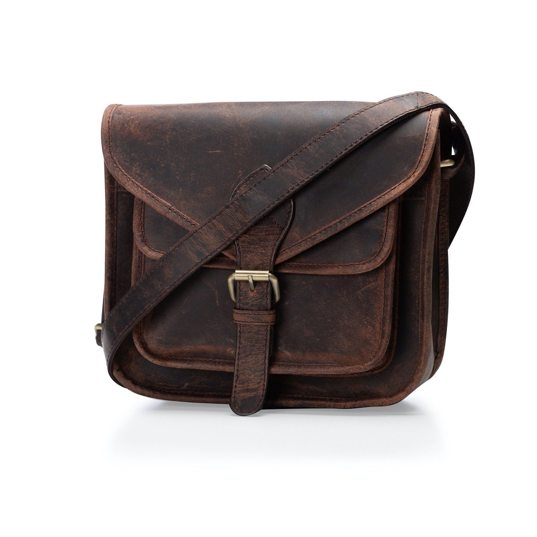 The Leather Crossbody Bag Sedona by Vintage Leather is a brown buffalo leather bag with a long adjustable strap, front flap and buckle closure, an exterior pocket under the flap, and a stylishly worn vintage look.